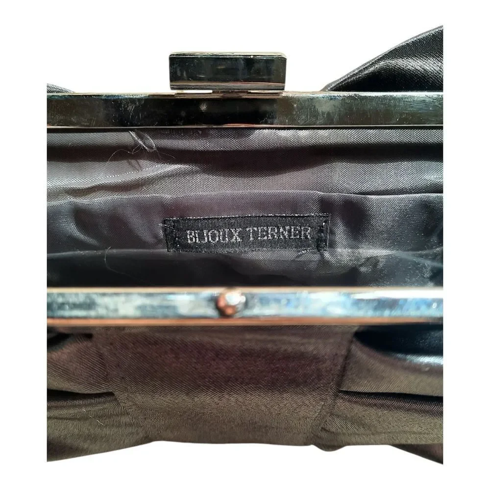Bijoux Terner Shimmering Silver Bow Clutch